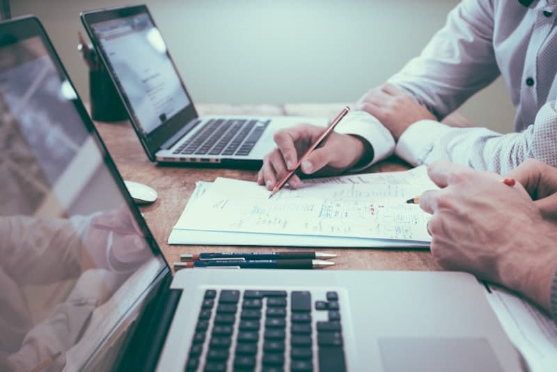Business professionals reviewing planning documents